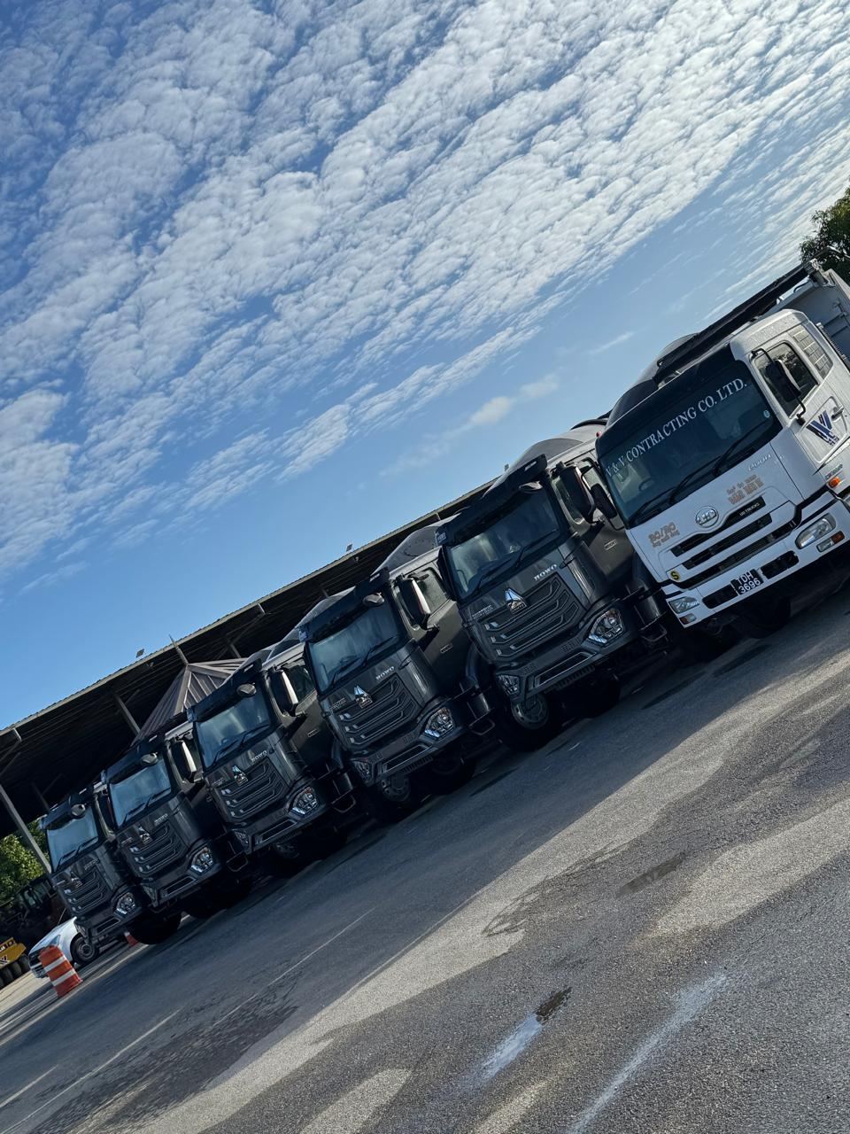 Howo and UD tipper trucks at the yard