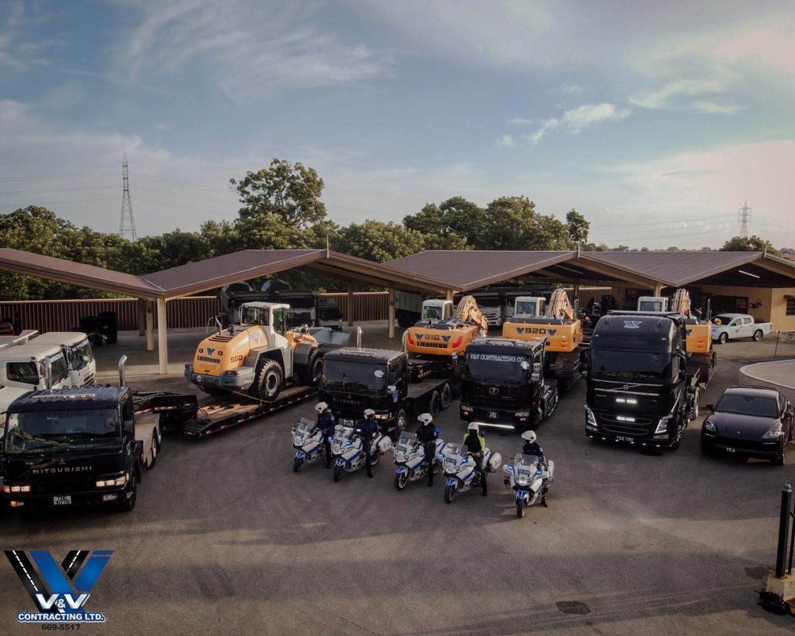 V and V Contracting fleet of excavators, loaders and trucks lined up at the St. Helena yard